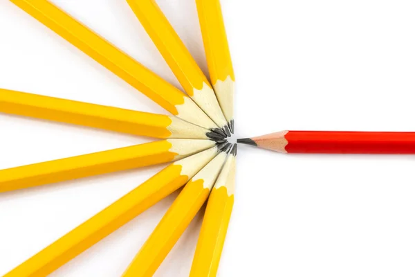 Red pencil and yellow pencils — Stock Photo, Image