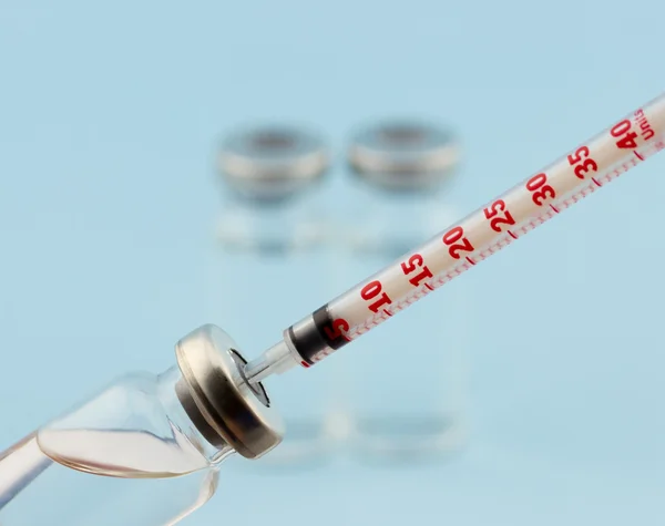 Medicine ampoule (vial) with insulin syringe — Stock Photo, Image