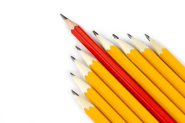 Red pencil and yellow pencils — Stock Photo, Image