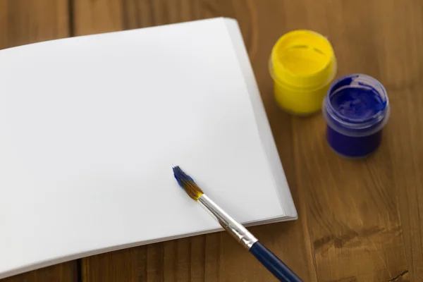 Painted Ukrainian flag on sketchbook — Stock Photo, Image