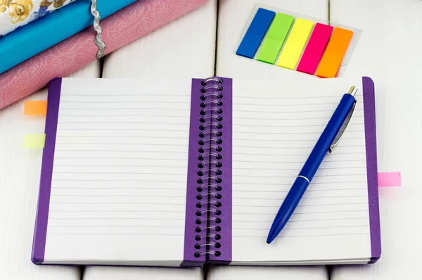 Notebook with pen and colorful stickers — Stock Photo, Image