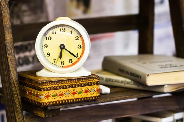 Retro alarm clock with book — Stock Photo, Image