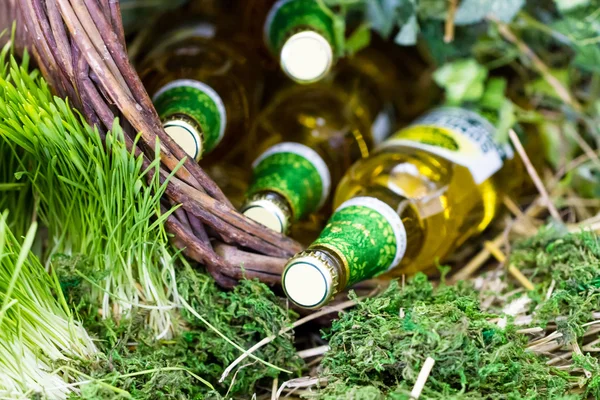 Beer bottles in basket — Stock Photo, Image