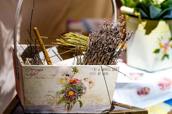 Dried flowers in vintage wooden basket — Stock Photo, Image