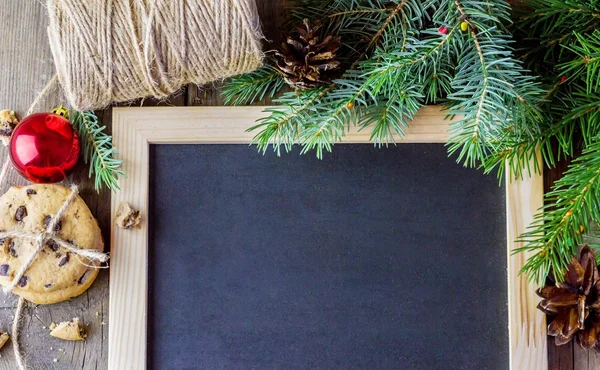 Blank blackboard with fur-tree branches — Stock Photo, Image