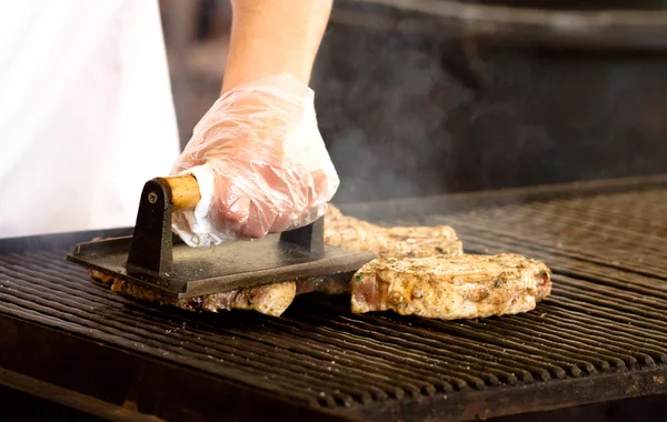 Chef cook a steaks on grill — Stock Photo, Image