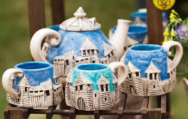 Souvenir ceramic cups and teapot — Stock Photo, Image