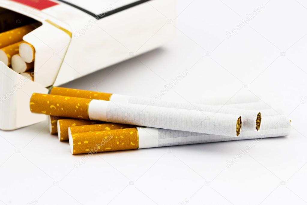 Group of cigarettes lying near box