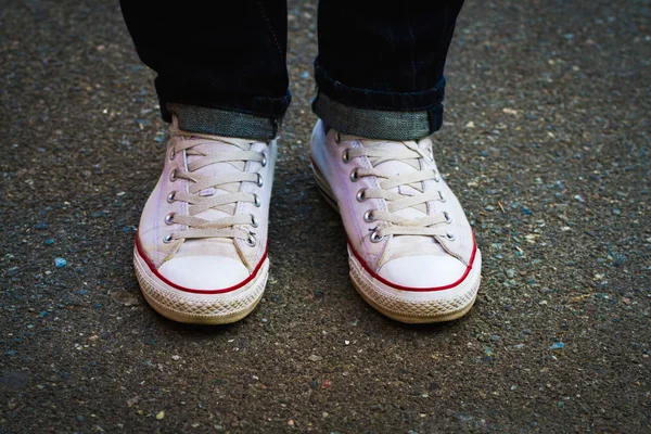 White mens shoes on asphalt — Stock Photo, Image