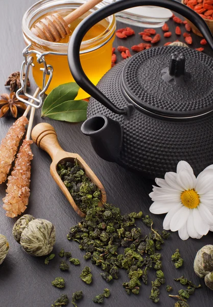 Still life with green tea and honey over black stone — Stock Photo, Image