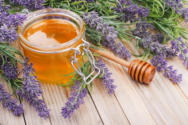 Jar of liquid honey with lavender — Stock Photo, Image