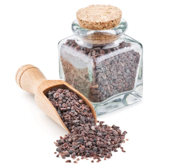 Indische schwarzes Salz, Kala Namak, in einer Glasflasche — Stockfoto