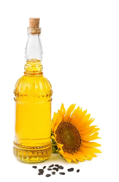 Sunflower oil and seeds isolated on white — Stock Photo, Image