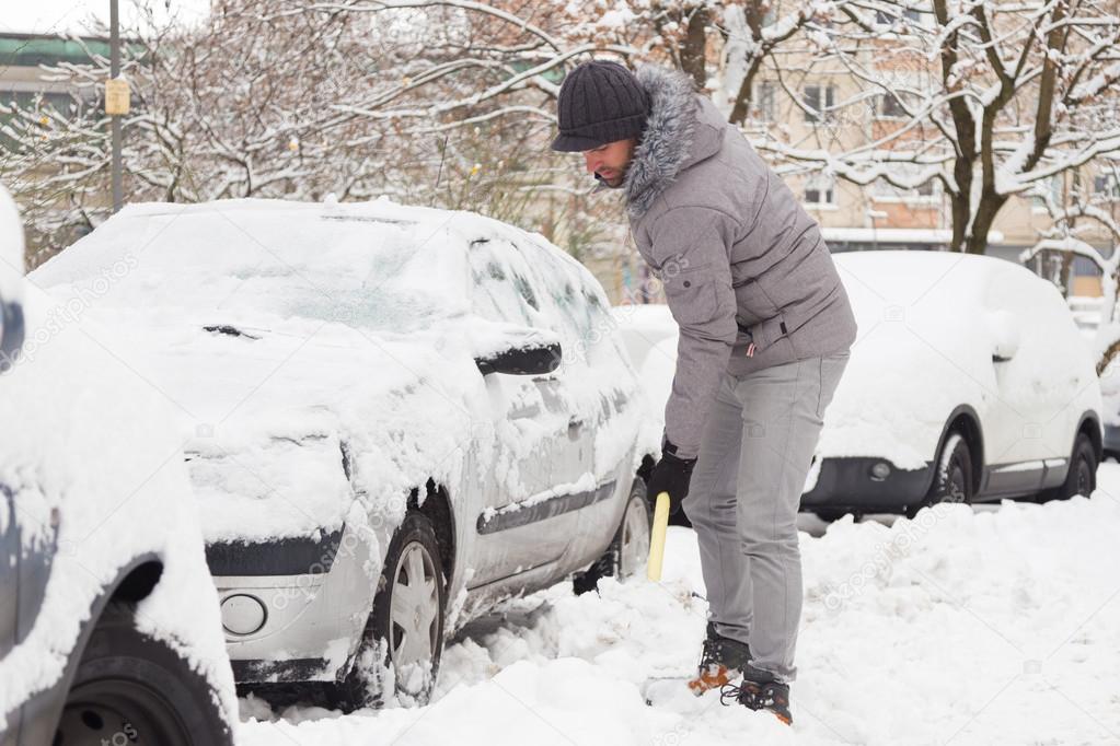 Man shoveling snow in winter.