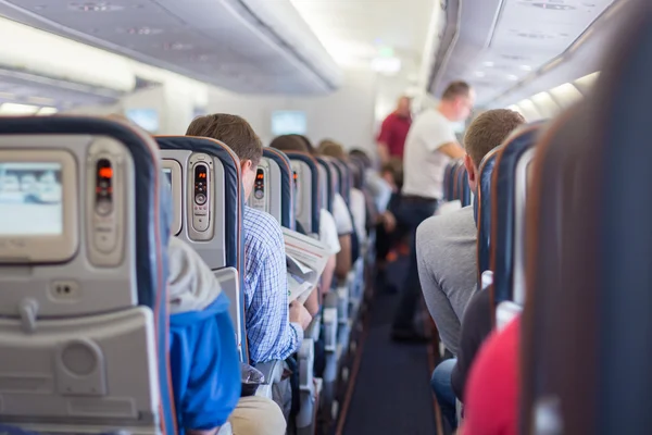 Passengers on commercial airplane. — Stock Photo, Image