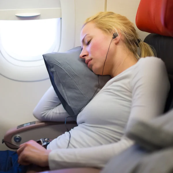 Lady traveling napping on a plain. — Stock Photo, Image