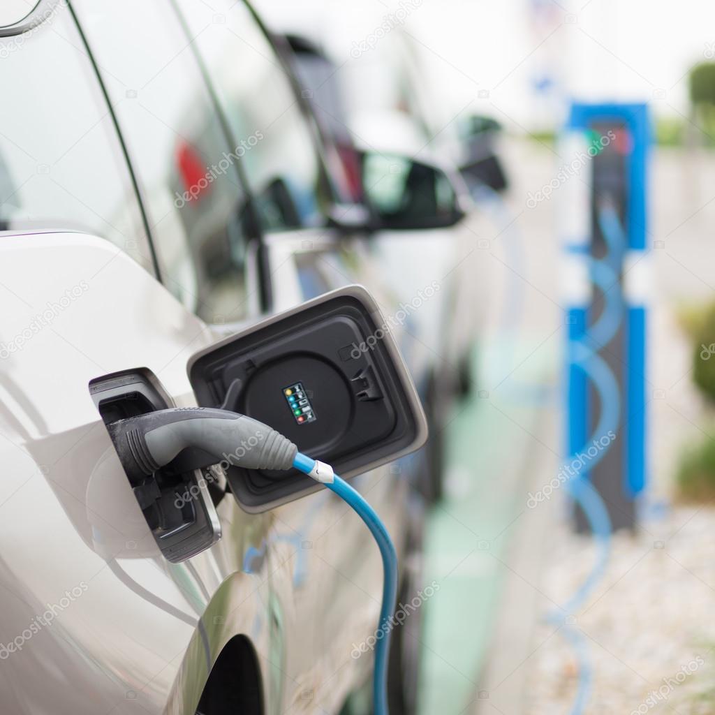 Electric Car in Charging Station. — Stock Photo © kasto 109173712