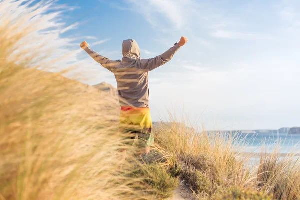 Sporty active man enjoying beauty of nature.