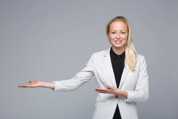 Business woman showing hand sign to side. — Stock Photo, Image