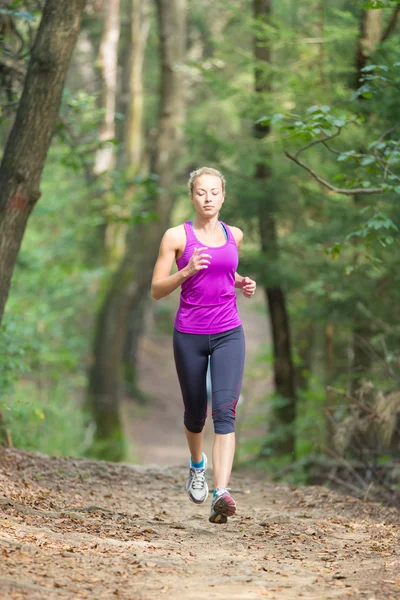 Pretty young girl runner in the forest. — Stock Photo, Image