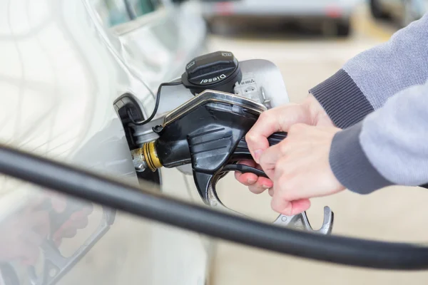 Petrol being pumped into a motor vehicle car. — Stock Photo, Image