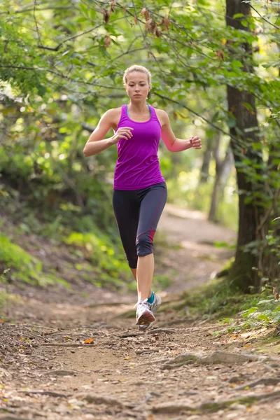 Pretty young girl runner in the forest. — Stock Photo, Image