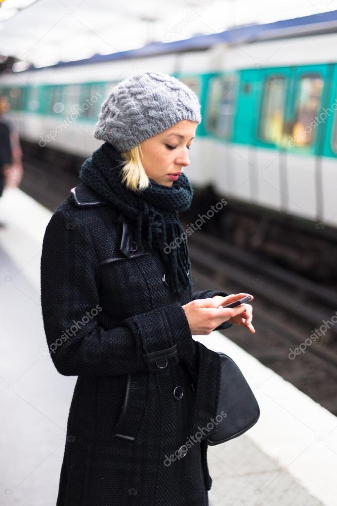 Woman on a subway station.