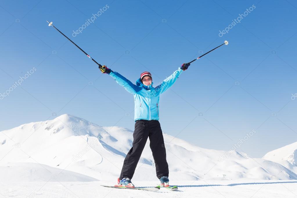 Excited woman skier.