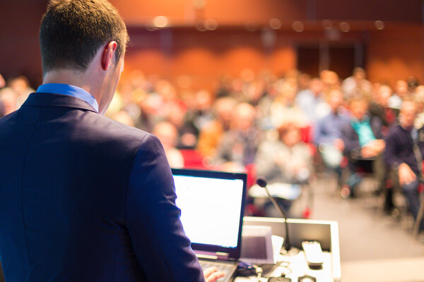 Public speaker at Business Conference.