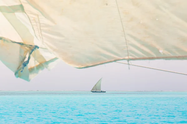 Traditional wooden sailboat sailing on horizon. — Stock Photo, Image