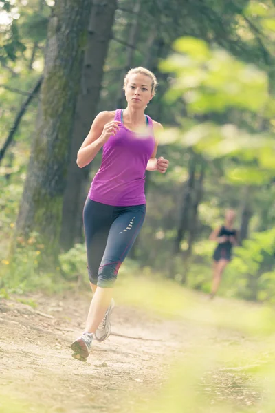 Pretty young girl runner in the forest. — Stock Photo, Image