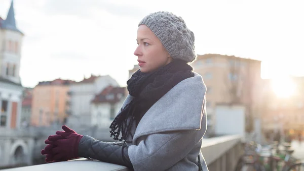 Thoughtful woman outdoors on cold winter day. — Stock Photo, Image