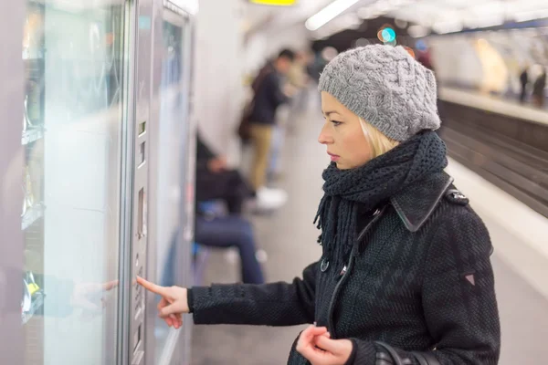 Lady buying ticket for public transport. — Stock Photo, Image