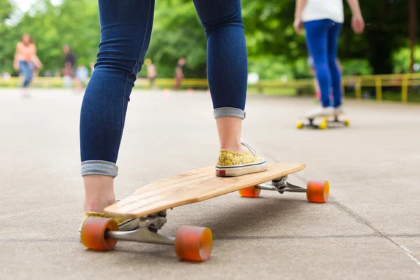 Teenage girl practicing riding long board. — Stock Photo, Image