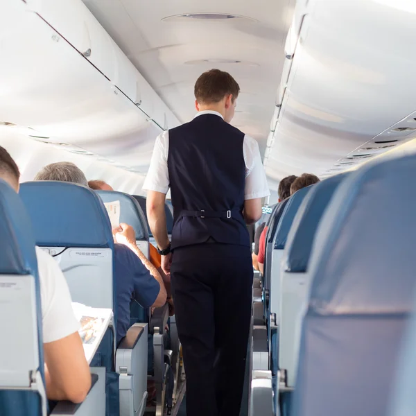 Steward on the airplane. — Stock Photo, Image