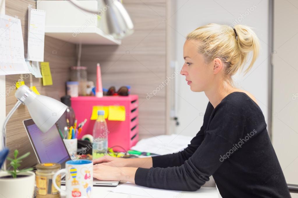Businesswoman working on computer in office.