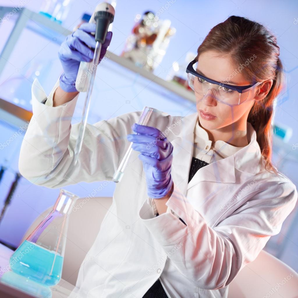 Young scientist pipetting in life science laboratory. Stock Photo by ©kasto 82789460