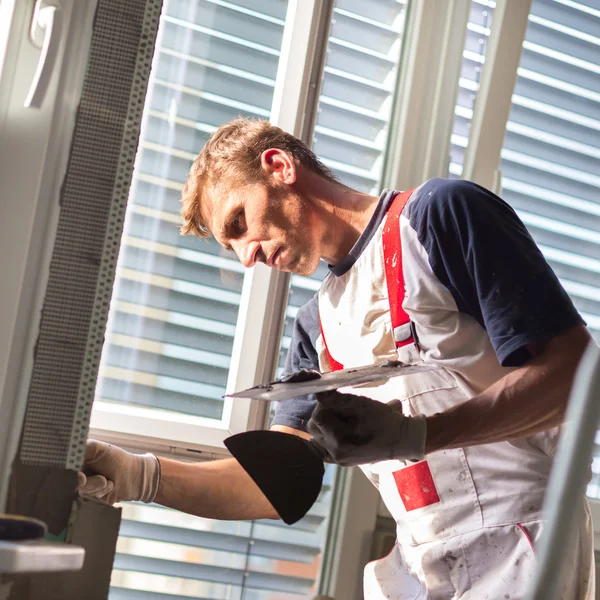 Plasterer renovating indoor walls and ceilings. — Stock Photo, Image