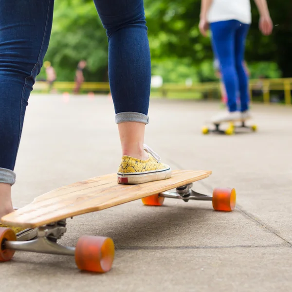 Teenage girl practicing riding long board. — Stock Photo, Image