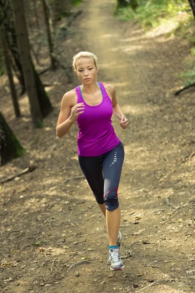 Pretty young girl runner in the forest. — Stock Photo, Image