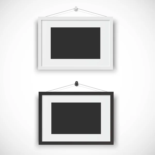 Blank picture frame set hanging on wall — Stock Vector