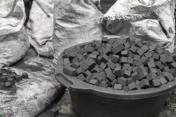 Bowl of charcoal cubes for hookah — Stock Photo, Image
