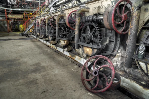 System of gear wheels run by belt in Gondang Baru, Java, Indonesia — Stock Photo, Image