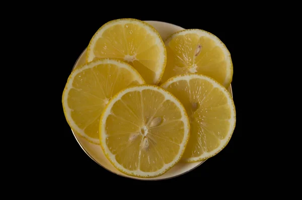 Yellow Ripe Lemon Sliced Wedges White Plate Black Isolated Background — Stock Photo, Image