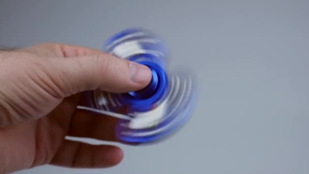 Blue Hand Spinner Rotating Man Hand — Stock Video