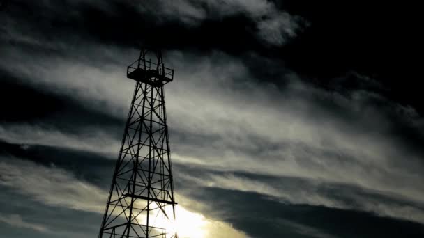 Silhouette old oil tower — Stock Video