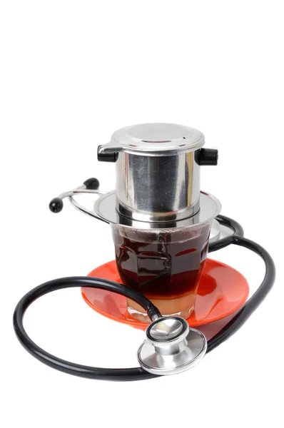 Kahve çekirdekleri ile stetoskop — Stok fotoğraf
