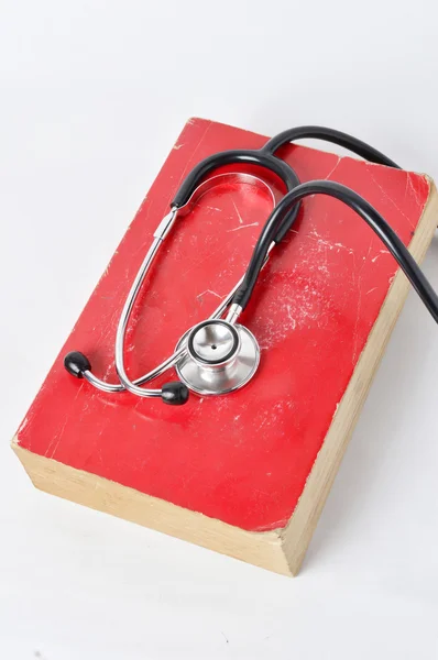 Stethoscope on red old book — Stock Photo, Image