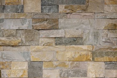 Bu dokulu taş duvarla tasarımlarınıza çiğ, dünyevi zarafet katın. Modern, kırsal alanlar için mükemmel..