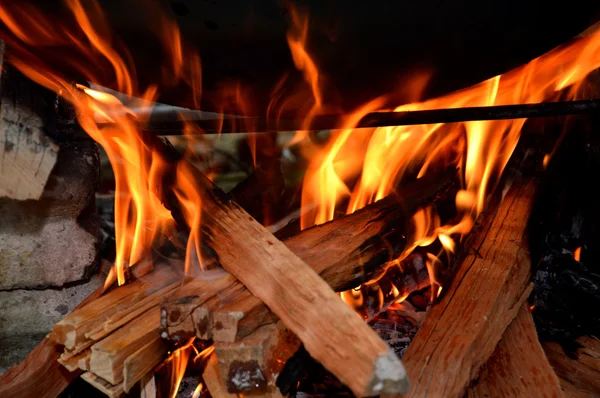 Firewood in the fireplace hearth cooking — Stock Photo, Image
